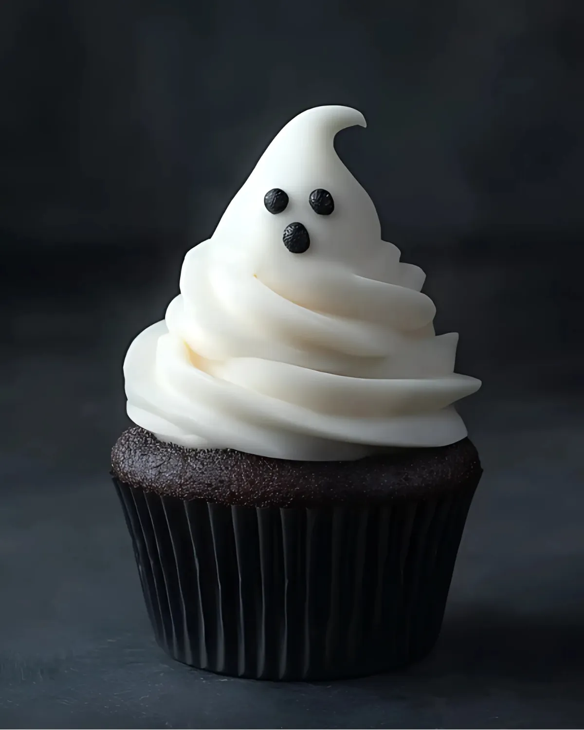 Ghost Cupcakes with spooky white frosting and chocolate cupcake base for Halloween