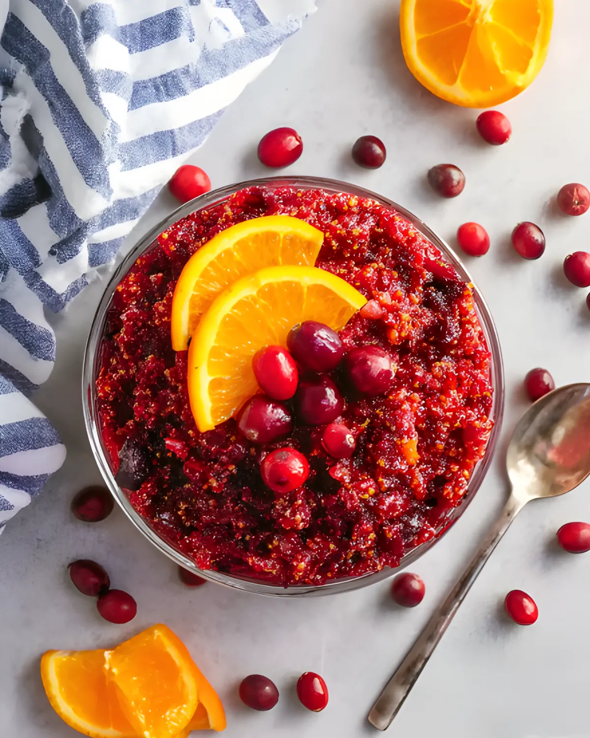 Fresh Cranberry Orange Relish made with whole cranberries and orange slices in a clear glass bowl